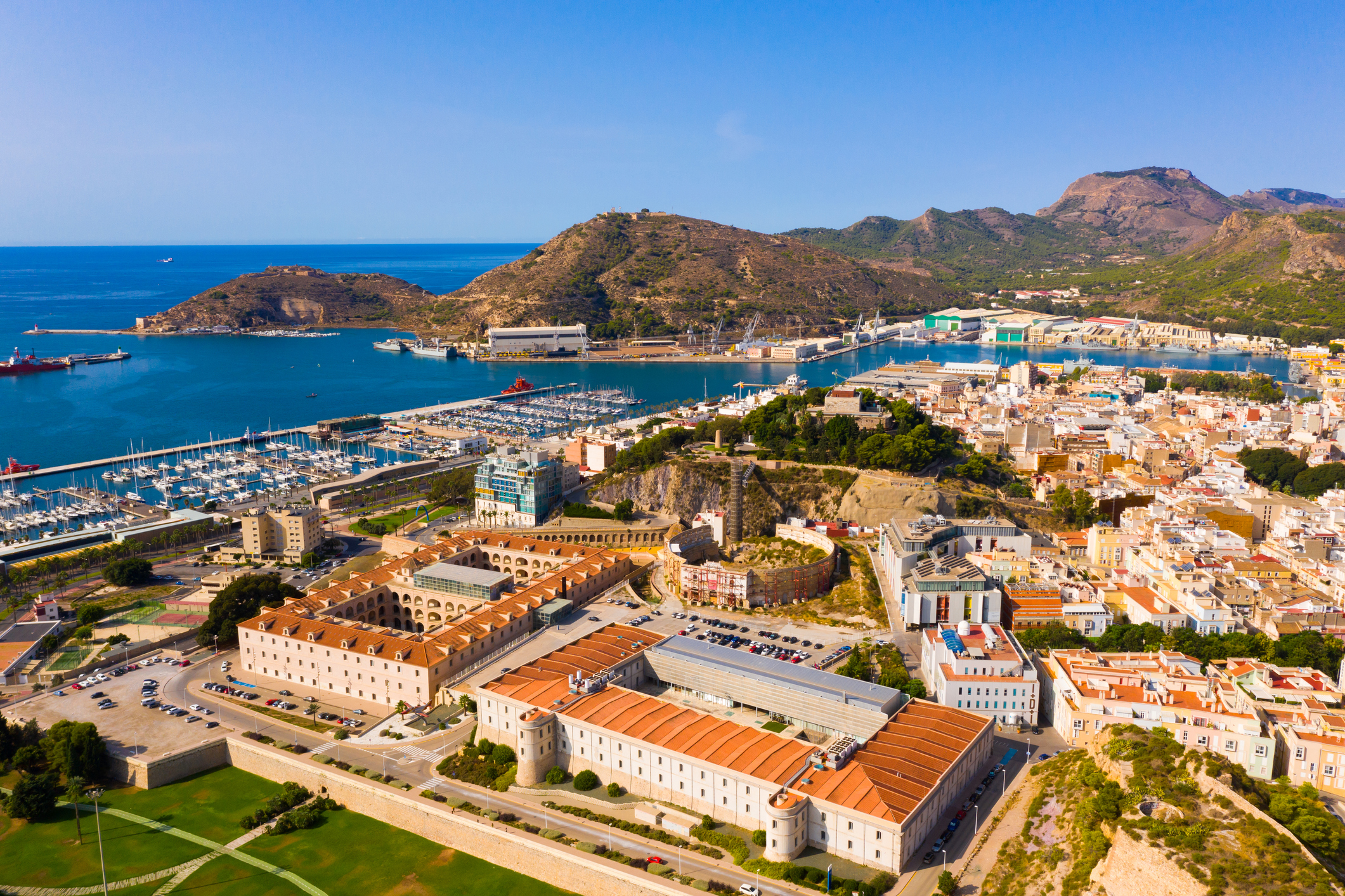 Aerial view of Cartagena by Mediterranean coast overlooking port and marina, Spain
